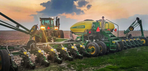 Young Farmer on Farm Equipment